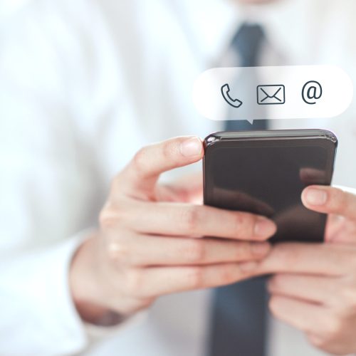 contact-us-hand-businessman-holding-mobile-smartphone-with-icon-cutomer-support